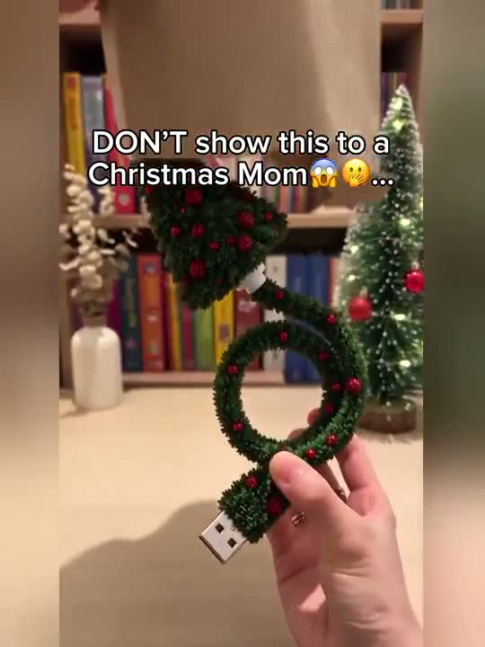 Video still of the Noel Glow style USB Christmas projector held in a hand